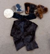 A quantity of fur to include a fur stole, two pairs of fur and leather gloves, a fur hat and two fur