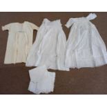 Three white cotton christening gowns, another childs cream dress with floral embroidery and 3