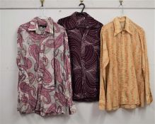 Three gentleman's 1970's / 80's patterned shirts, to include a brown and orange shirt with winged