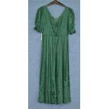 A c.1980's Laura Ashley green cotton dress, with V-neck, short sleeves with bow detail, v-back