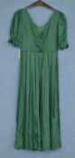 A c.1980's Laura Ashley green cotton dress, with V-neck, short sleeves with bow detail, v-back