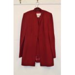 A red Nina Ricci, the 3/4 length lined fitted jacket with gilt bow buttons with asymentric cuffs,