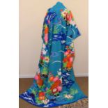 A Japanese furisode kimono, with turquoise ground and polychrome floral decoration, with gilt
