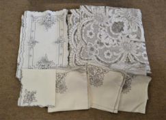 A grey embroidered cutwork tablecloth and nine matching napkins, together with a quantity of