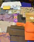 A large quantity of designer fashion paper bags and packaging to include Dolce & Gabbana, Prada,