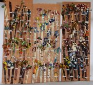 A large quantity of lace bobbins, to include bone, wood and metal examples, all beaded with a mix of