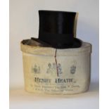 A black silk top hat by Henry Heath Ltd., London, in original cardboard box Inner circumference 54cm