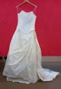 A cream silk two piece wedding dress by Val Koots, comprising a full skirt with side ruching and