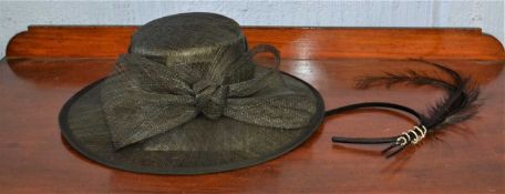 A black straw hat by First Avenue and a feather and diamante fascinator, (2)