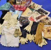 A quantity of lady's accessories to include silk and other scarves, leather gloves, stockings etc