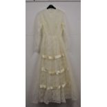 A 1970's / 80's cream wedding dress, with floral lace overlay and sequins to body, sheer lace