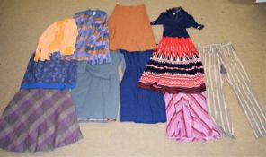 A quantity of c.1970's/80's clothing to include A-line skirts, knitwear, etc. (10)