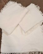 Three white cotton waffle and patterned double bed covers