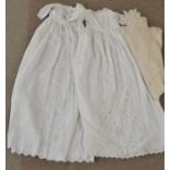 Two white cotton christening gowns, both with broiderie anglaise style embroidered panels to