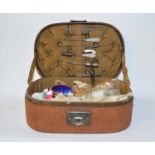 A leather sewing box and mother of pearl handle sewing tools, also included a pair of Harrison