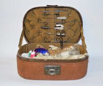 A leather sewing box and mother of pearl handle sewing tools, also included a pair of Harrison