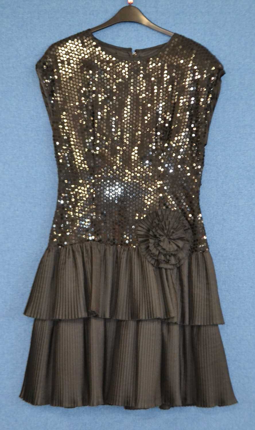 A c.1980's/90's black sequin and ruffled cocktail dress by John Charles, size 14, together with a