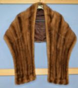 A mink fur stole by Williams & Sons, Kew, lined in brown satin