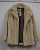 A lady's cream fox fur jacket by Mallinby, size 14