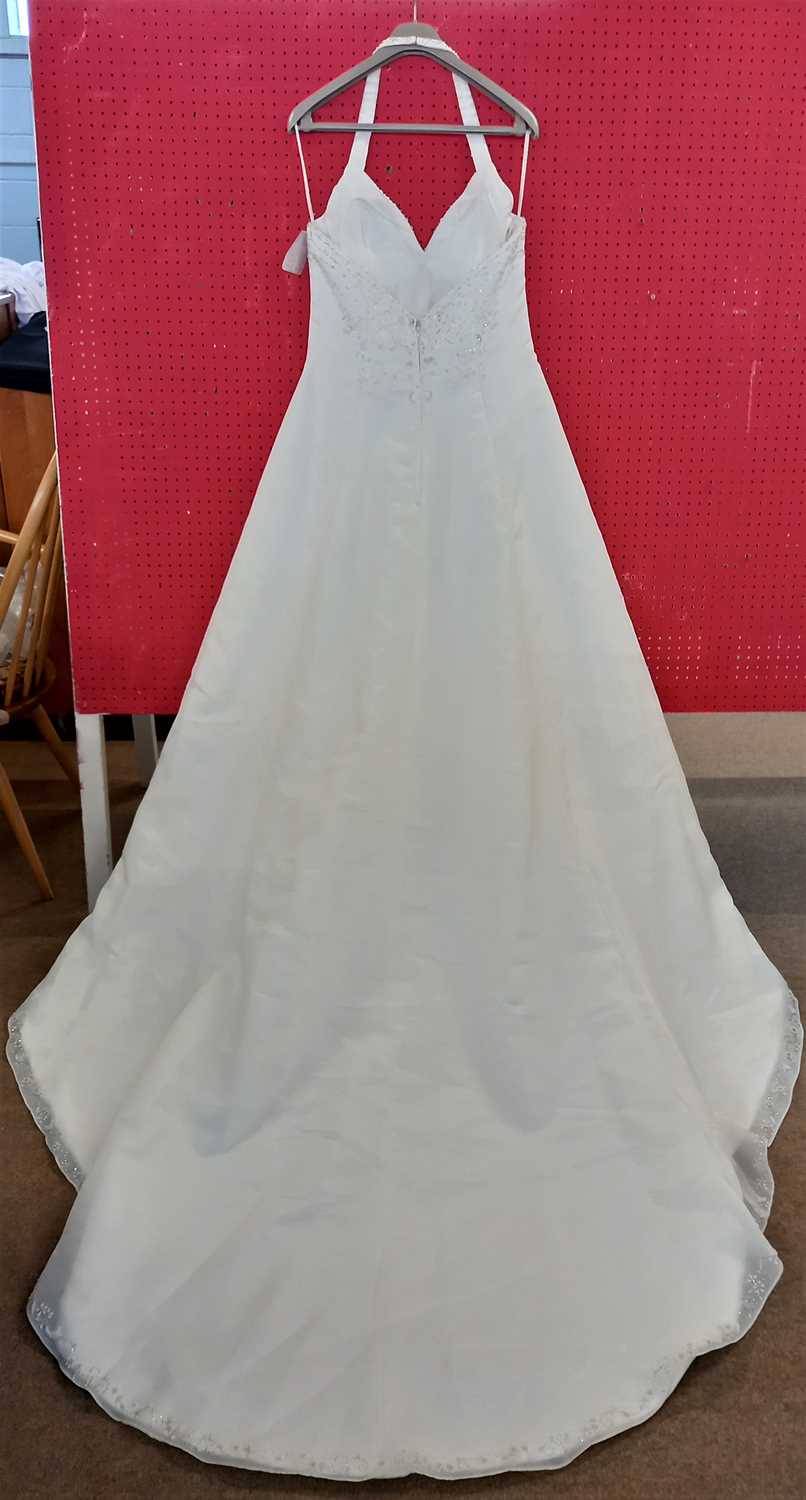 A cream satin halterneck wedding gown, with beaded bodice, chiffon overaly and beaded hemline and - Image 4 of 5
