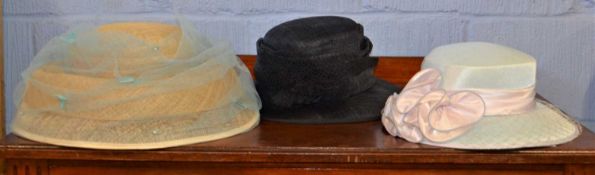 Three lady's hats to include a straw hat with pale blue netted overlay with bead detailing, a pale