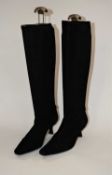 A pair of Stuart Weitzman for Russell & Bromley black suede boots, size 6, with plastic boot