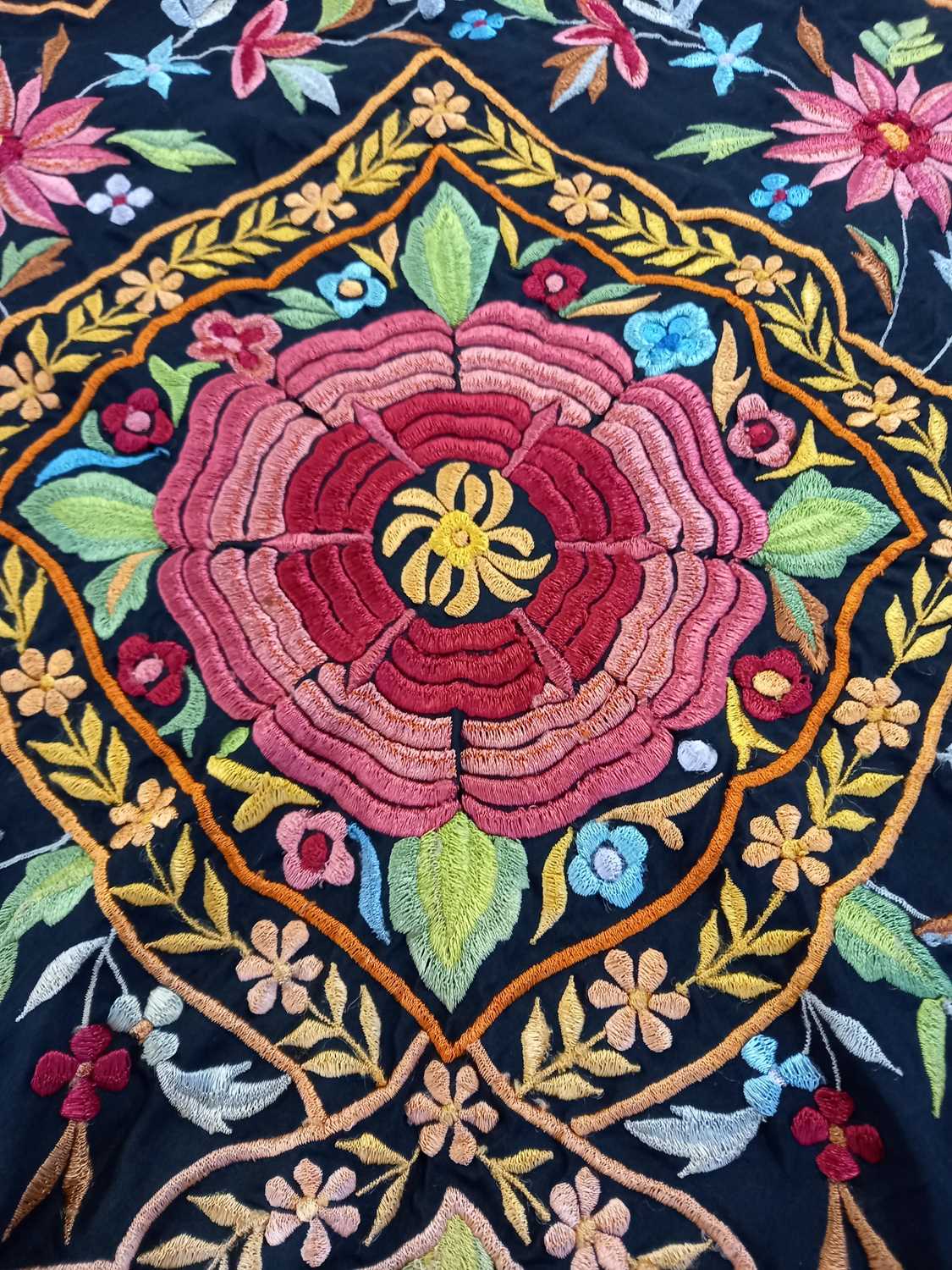 A black silk embroidered shawl, with central pink flower surrounded by floral border and further - Image 2 of 4