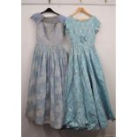 A mid 20th century pale blue and white floral chiffon overlay evening dress, with blue net