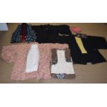 A quantity of Japanese clothing to include a black and yellow reversible kimono jacket, a black