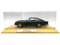 A cased Danbury Mint die-cast 1964 Aston Martin DB5, as seen in James Bond - Goldfinger.Limited