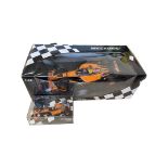 A boxed Minichamps 1:18 scale model: Orange Arrows 2002 Showcar, together with a smaller 1:43
