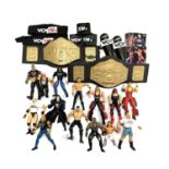 A collection of NWO Wrestling figures, belts, trading cards etc