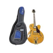 An Adam Black Co semi-acoustic archtop jazz guitar in yellow.With Bigsby vibrato piece, Seymour