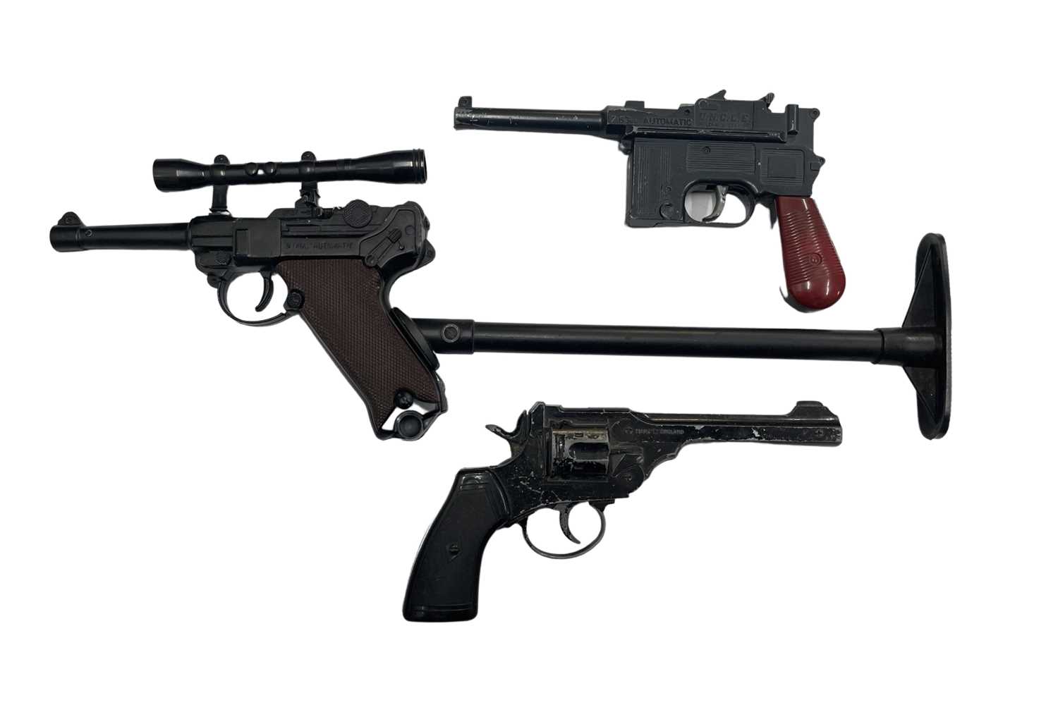 A pair of 1960s replica pistols from MAN FROM UNCLE and one other, to include: - 9mm Automatic