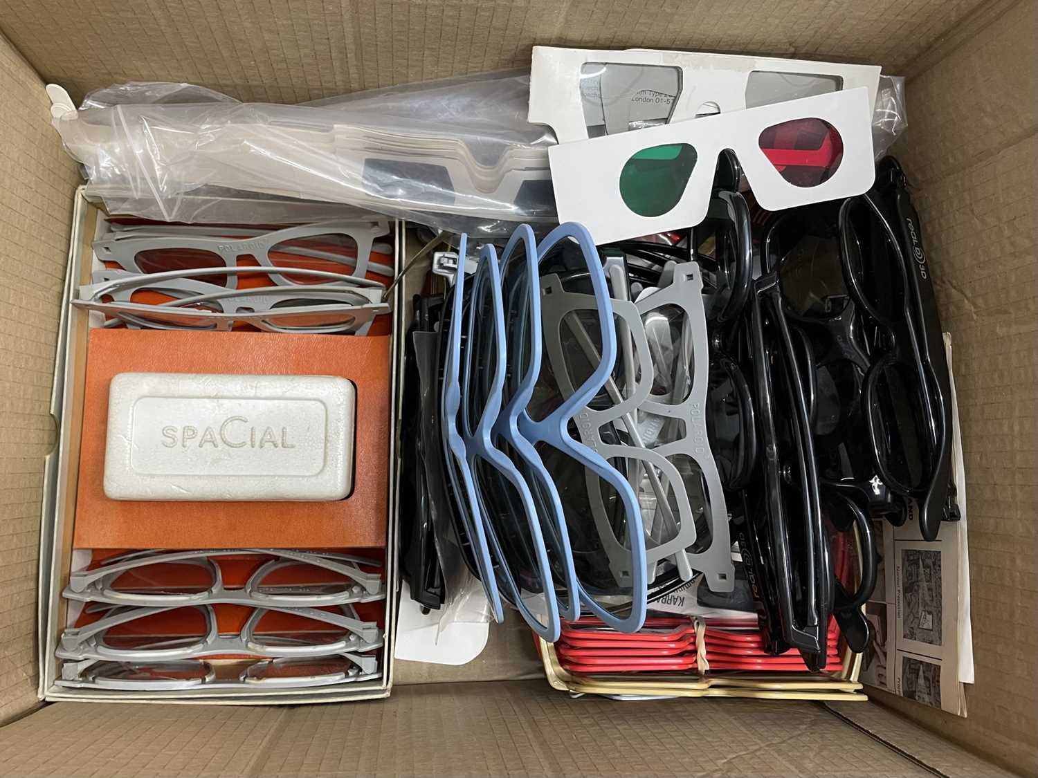 A quantity of various 3-D film viewing glasses