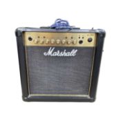 A Marshall MG15FX practice guitar amplifier, with original holographic tag