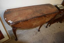An early Georgian drop leaf table of oval form raised on cabriole legs, various repairs and areas of