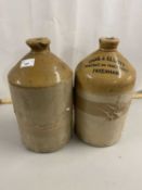 Two stone ware flagons, one marked Chas Elliott
