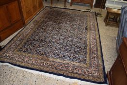 Large 20th Century wool floor rug with floral and geometric design