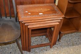 Nest of four modern Indian hardwood occasional tables, largest is 54cm wide