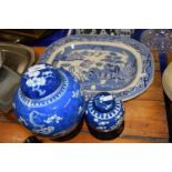 Willow pattern meat plate together with two Chinese prunus pattern ginger jars