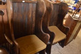 Pair of 20th Century dark oak and wing and barrel back chairs with loose seat cushions, 126cm high