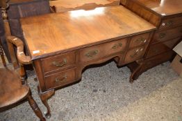 Reproductio walnut veneered five drawer desk or dressing table on cabriole legs, 105cm wide