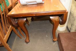 Drop leaf dining table on cabriole legs and casters, approx 104cm wide