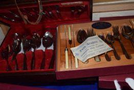 Two modern boxed cutlery sets