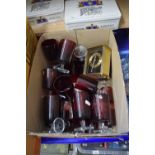 Quantity of ruby drinking glasses and a bedside clock