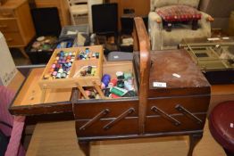 Freestanding expanding sewing box and assorted contents