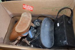 Quantity of assorted binoculars and cameras