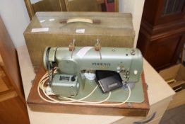 A Pheonix sewing machine, cased