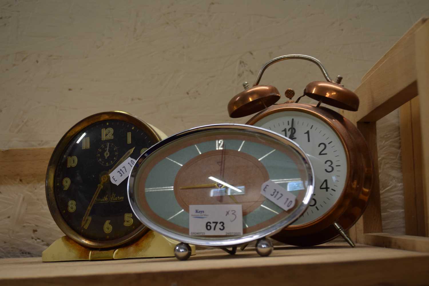 Three alarm clocks